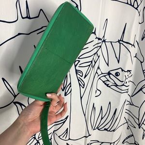 green tusk leather wristlet